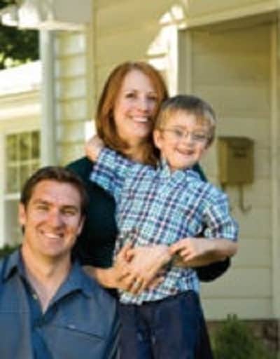 Barnwood Builders Mark Bowe with his wife Cindy Bowe and son Atticus.