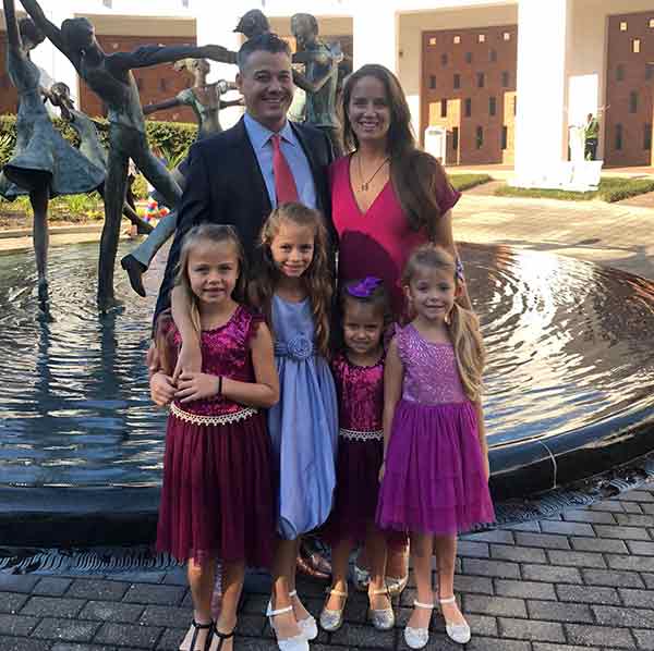 Image of Rob Mariano with his wife Amber Brkich and their kids