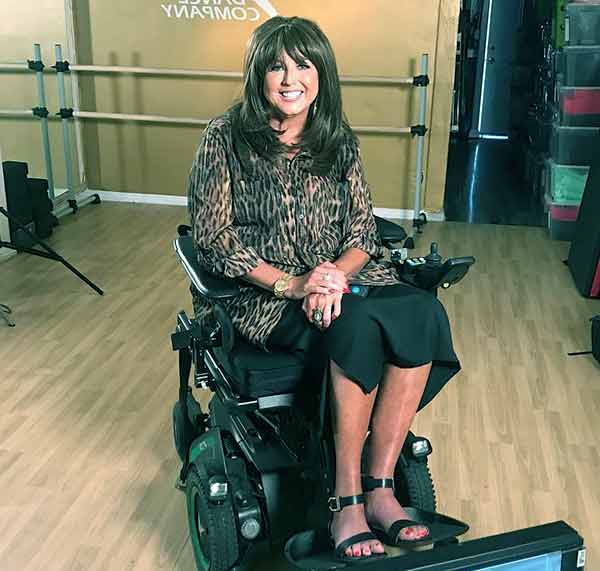 Image of Abby Lee Miller in wheelchair due to non-Hodgkin’s lymphoma blood cancer