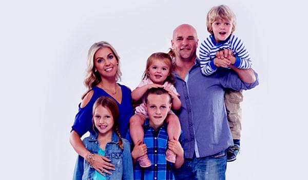 Image of Bryan Baeumler with his wife Sarah Baeumler and with their kids
